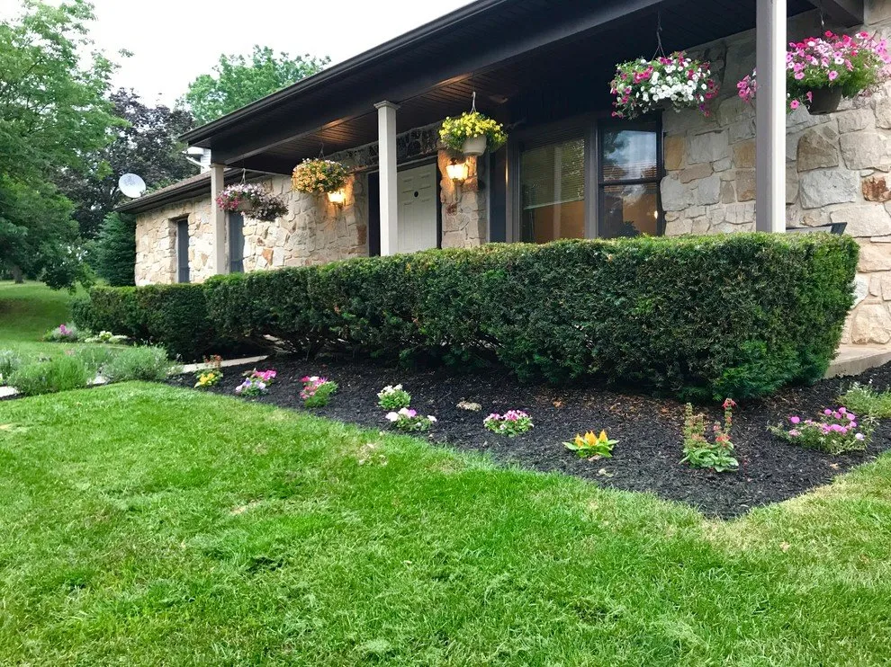 Custom outdoor landscaping for year-round maintenance in Oreland, PA by Gus' Groundskeeping
