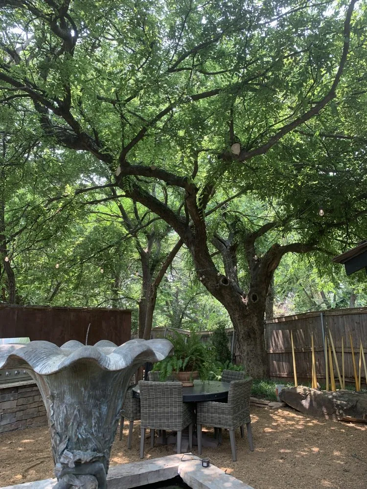 Custom landscape design for homes in Norman, OK by Gus'sTree Service and Landscape