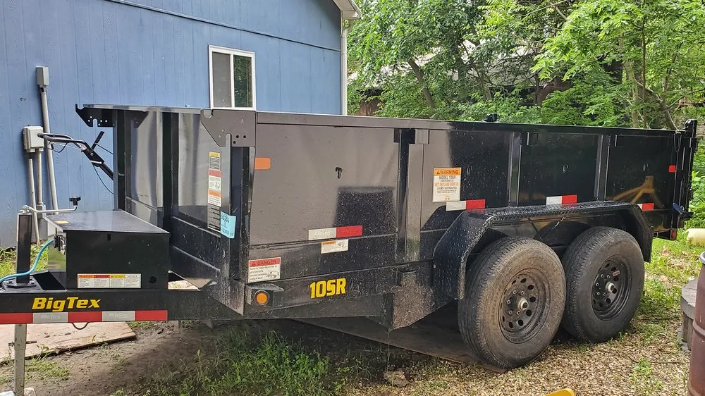 Top-rated lawn mowing service experts serving Wamego, KS - Guy on a Tractor