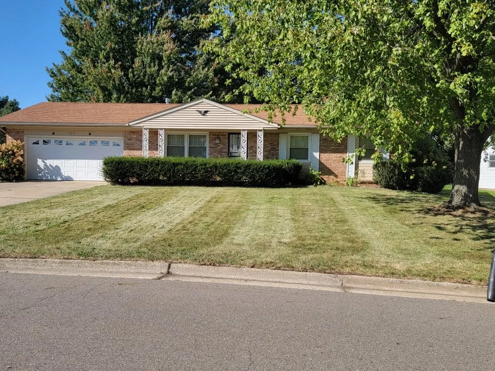 Professional lawn mowing service for homes in Battle Creek, MI by Guys with Ties Lawn Care