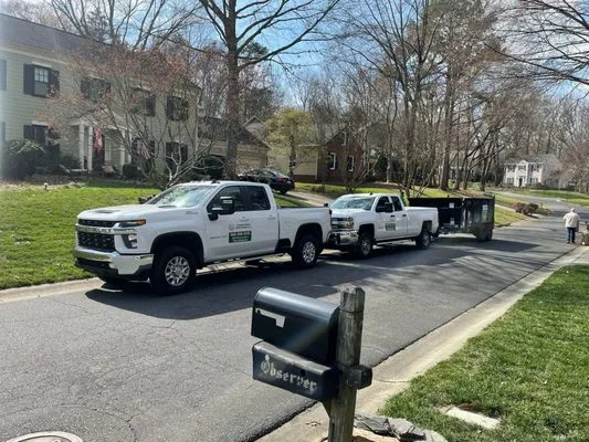 Guzman Green Land & Tree Logo