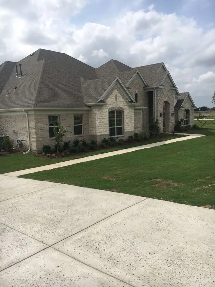 Custom landscape installation with custom design in Plano, TX by Guzman Irrigation + Landscape