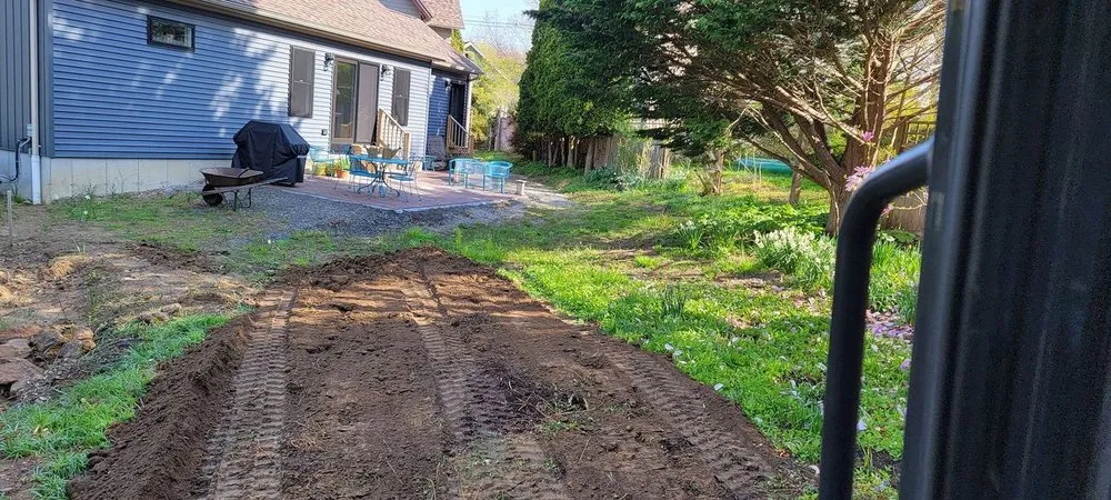 Professional lawn care service for residential properties in Ledyard, CT by H & H Landscaping