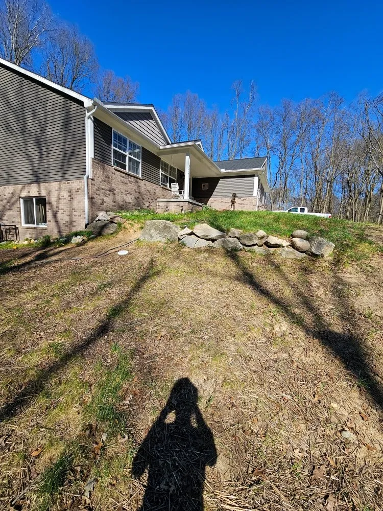 Local lawn mowing service for residential properties in Ortonville, MI by H & M Construction Solutions