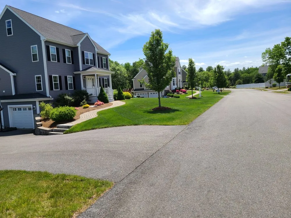 Professional lawn mowing service for residential properties in Brockton, MA by Halls Landscaping