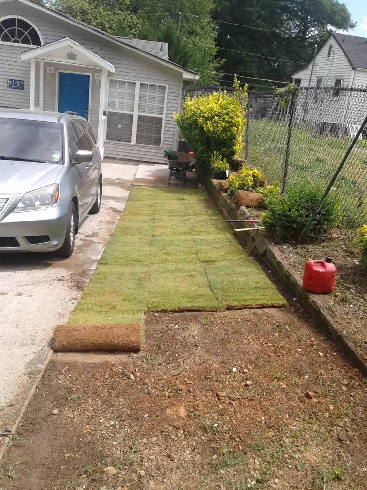 Affordable lawn mowing service with custom design in Lithia Springs, GA by Handy Andy Landscaping And Home Repair