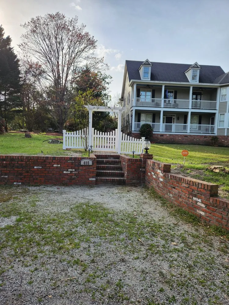 Custom yard cleanup service for residential properties in Darlington, SC by Handy Kings