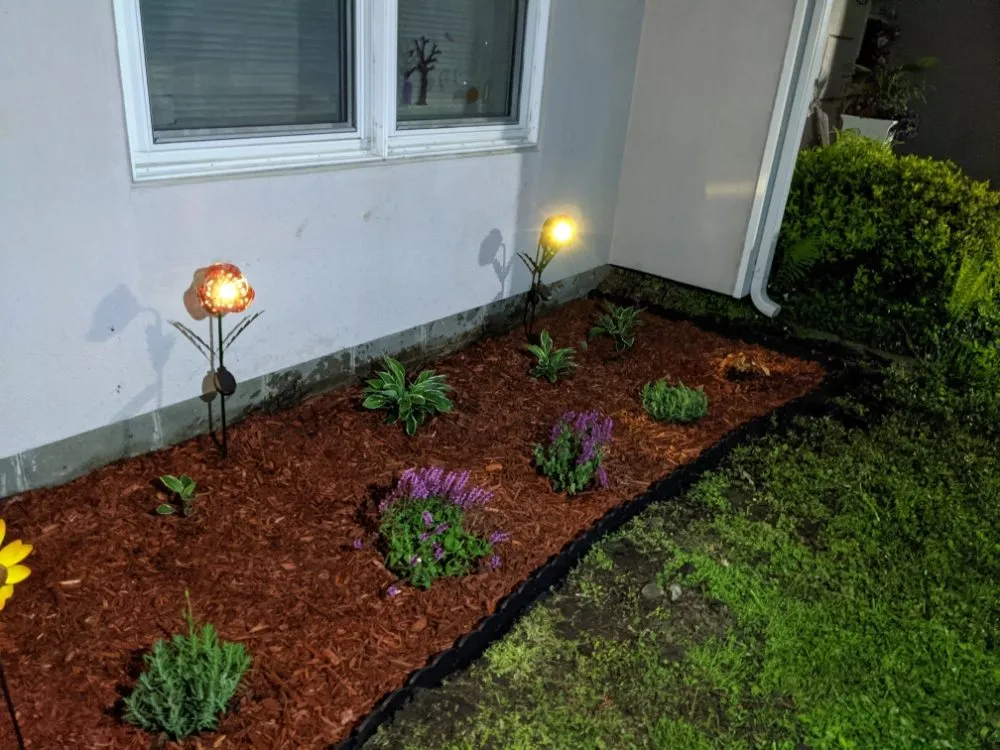 Custom yard cleanup service with custom design in West Liberty, IA by Handyman Todd's Lawn Care