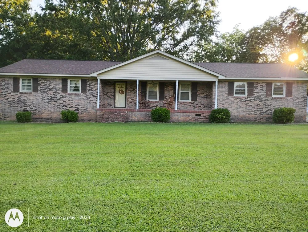 Custom outdoor landscaping with custom design in Joanna, SC by Hannah Family