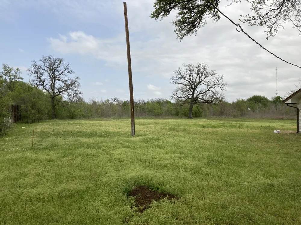 Affordable yard cleanup service for outdoor upgrades across Bastrop, TX - Happy Grass Lawn Service