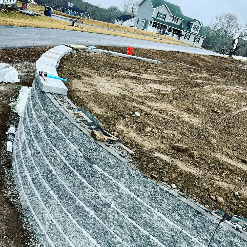 Custom landscape installation for year-round maintenance in Norwich, CT by Hardscape Brothers