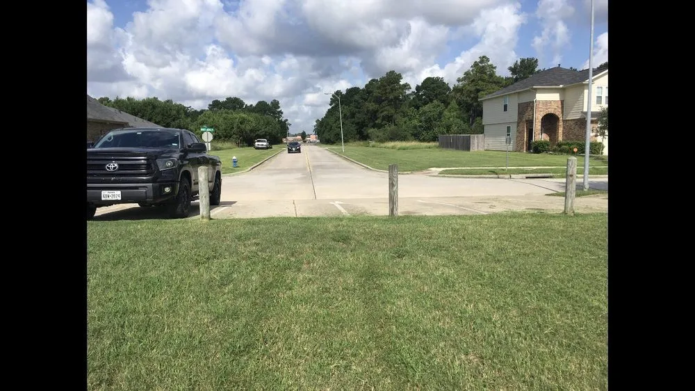 Professional lawn care service for residential properties in Houston, TX by Harmony Landscaping