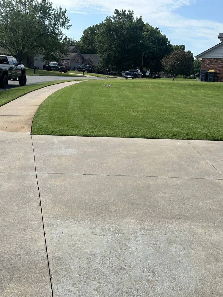 Custom landscape installation for year-round maintenance in Jenks, OK by Harper’s Lawn Care