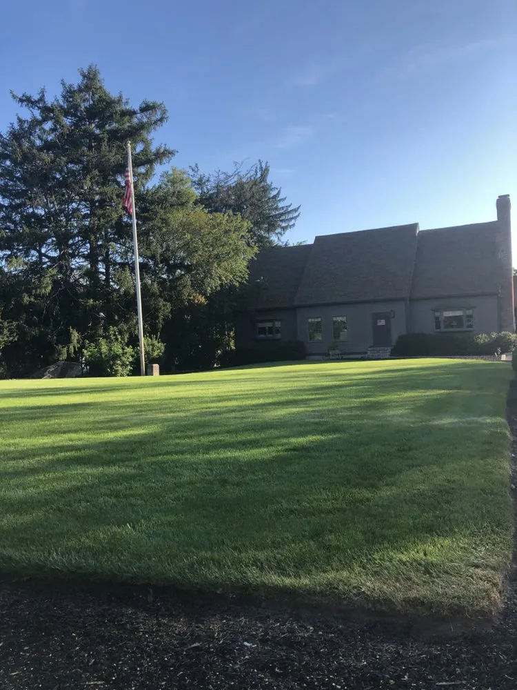 Custom outdoor landscaping for year-round maintenance in Carver, MA by Harriman Landscaping