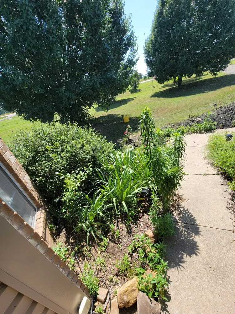 Custom landscape installation with custom design in Spiro, OK by Harrison's Lawn And Maintenance