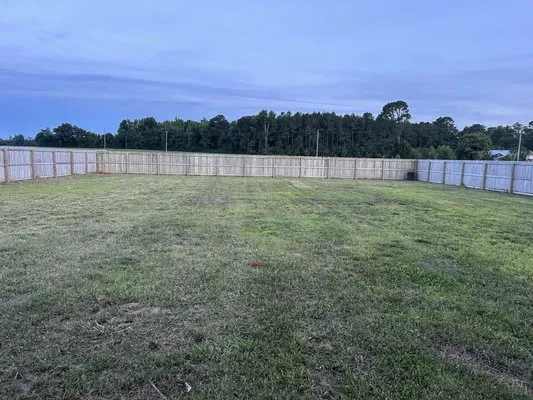 Harvey’s Quality Lawn care Logo