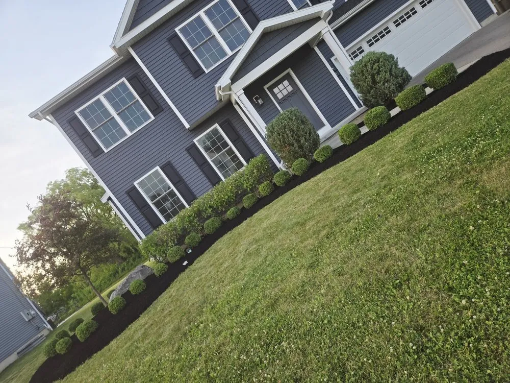Expert outdoor landscaping for homes in Depew, NY by Hauser's Complete Care