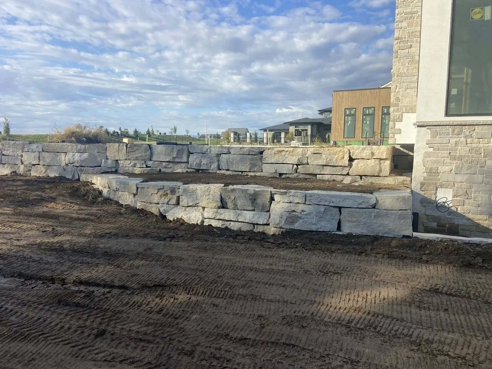 Custom landscape installation for beautiful yards in Pleasant Hill, IA by Hawkeye Van Ginkel Lawn & Snow