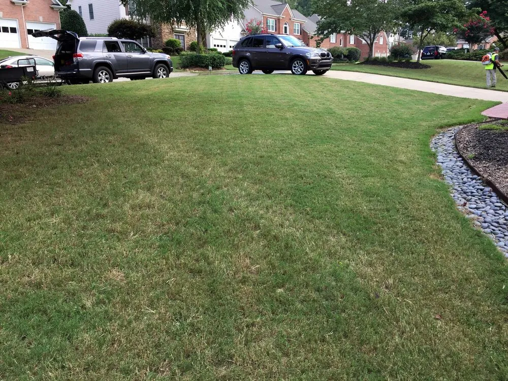 Reliable lawn care service for homes in Woodstock, GA by Hawks Landscaping