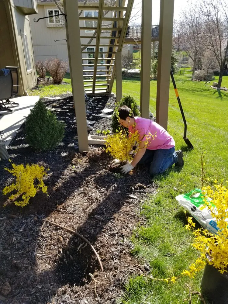 Professional garden landscaping for beautiful yards in Olathe, KS by Help From A Friend