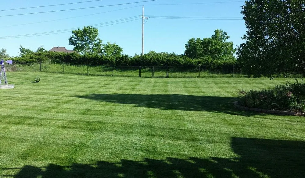 Trusted residential landscaping in Olathe, KS by Help From A Friend