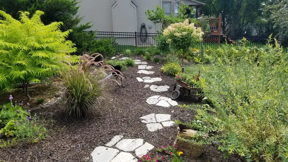 Professional yard maintenance in Olathe, KS - Help From A Friend