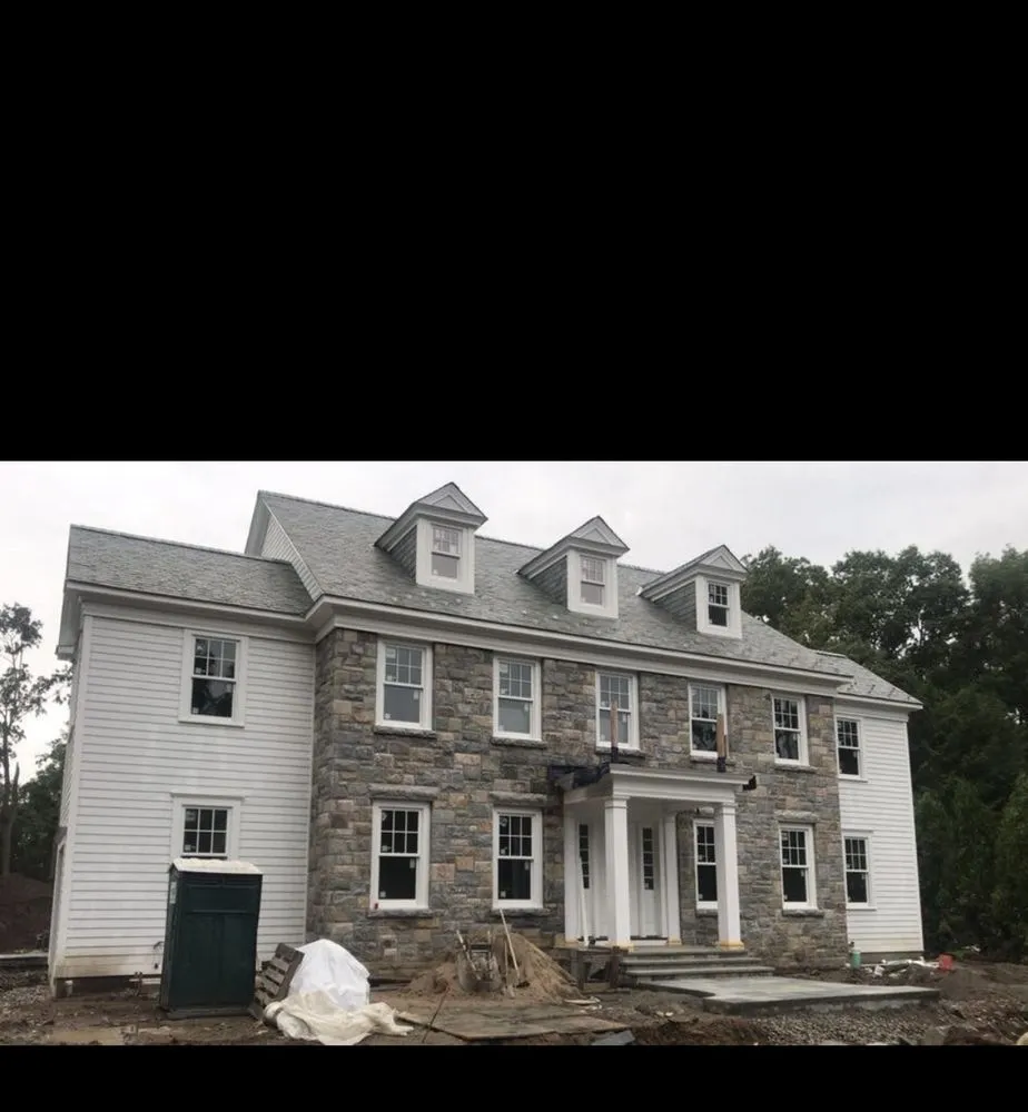 Local lawn mowing service for homes in Randolph, MA by Helping Hand Specialist