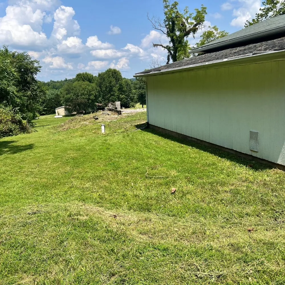 Expert lawn mowing service with custom design in Solsberry, IN by Helping Hands Lawn and Landscape