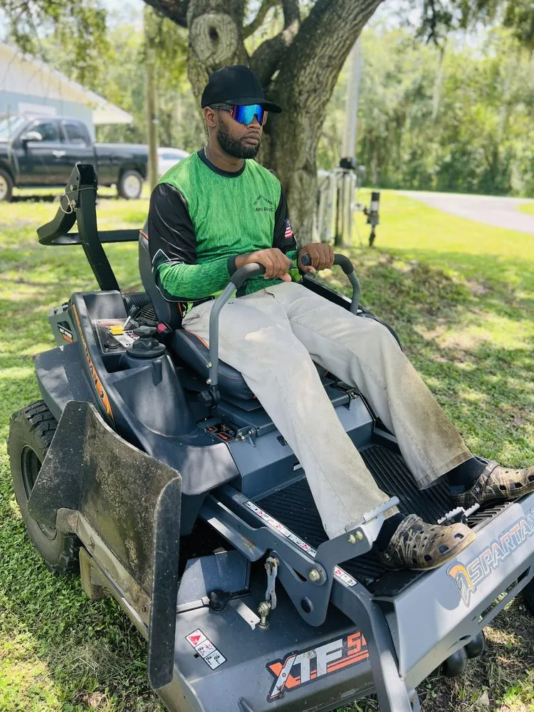 Expert yard maintenance for residential properties in Auburndale, FL by Helping Hands Lawn Service