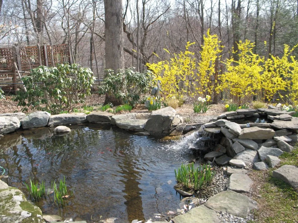 Affordable lawn mowing service for beautiful yards across Epsom, NH - Heritage Stoneworks