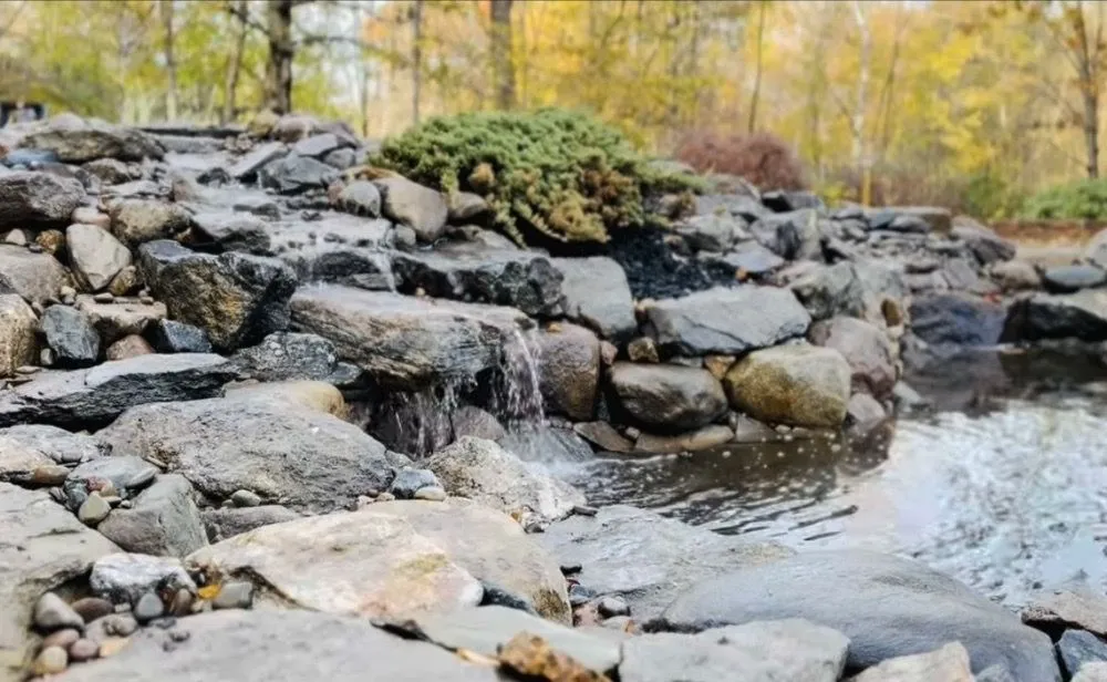 Custom landscape design for beautiful yards in Epsom, NH by Heritage Stoneworks