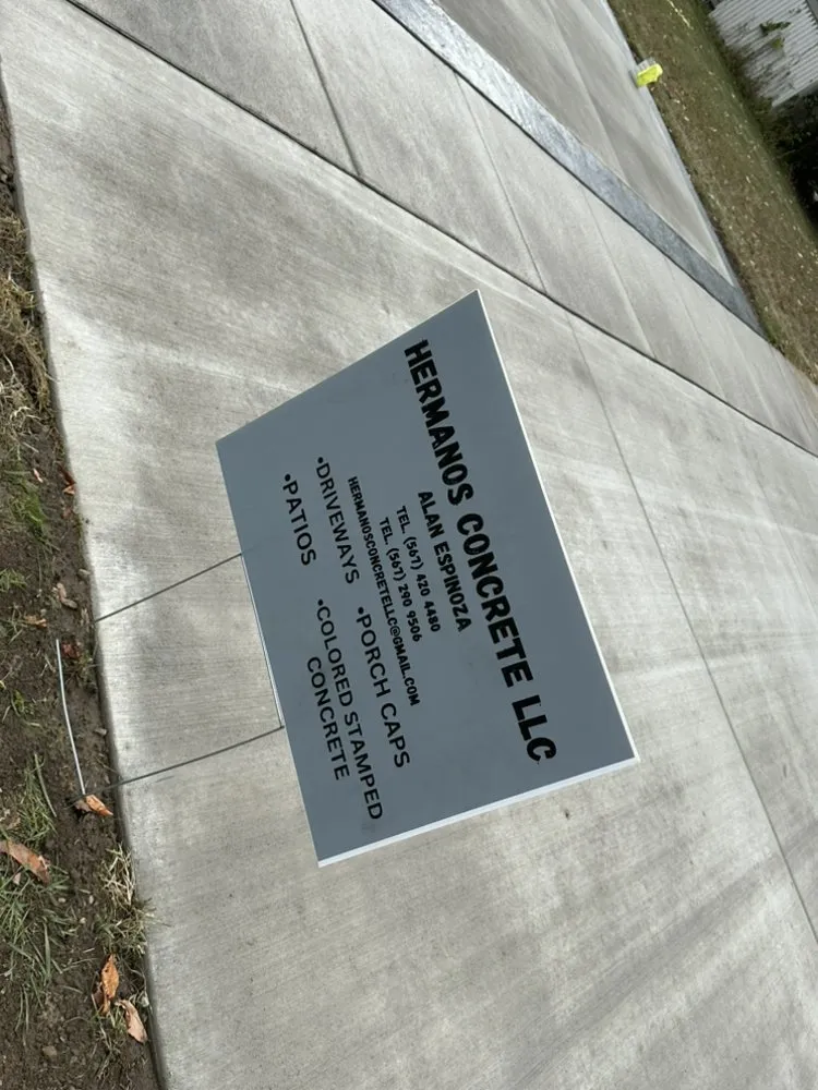 Custom landscape installation with custom design in Toledo, OH by Hermanos Concrete