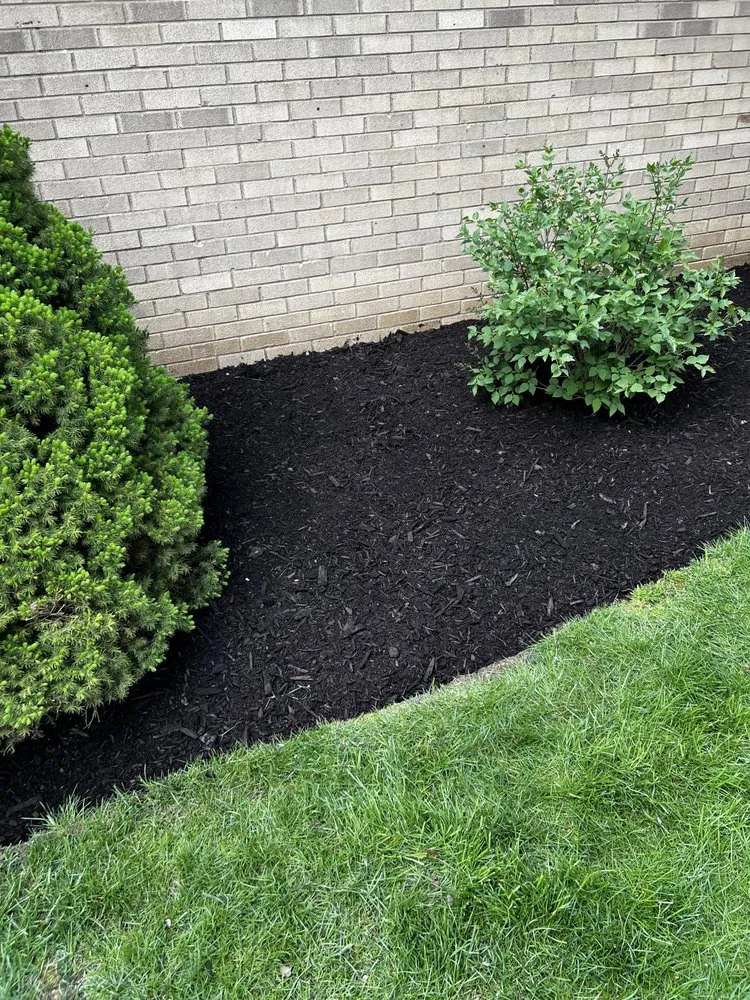 Professional landscape installation for homes in Canton, OH by Hermick Lawn Maintenance