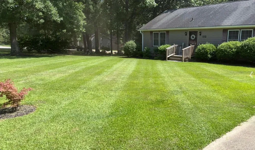 Professional lawn care service for residential properties in Four Oaks, NC by Higgins Lawn N Landscape Service