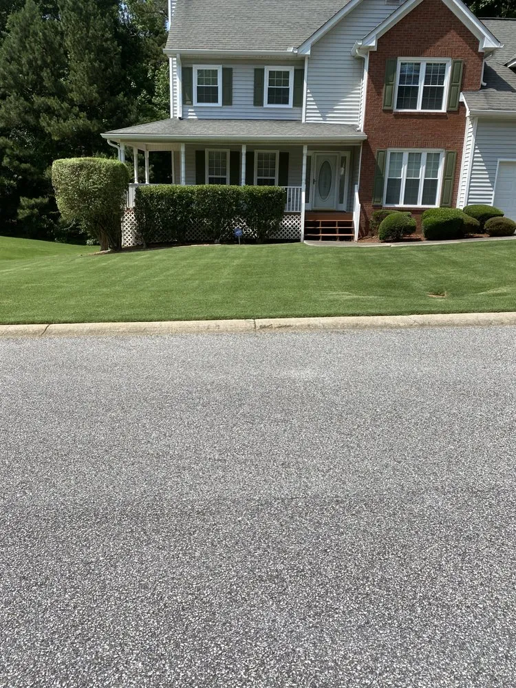 Professional lawn mowing service for residential properties in Fayetteville, GA by High Quality Lawn Maintenance