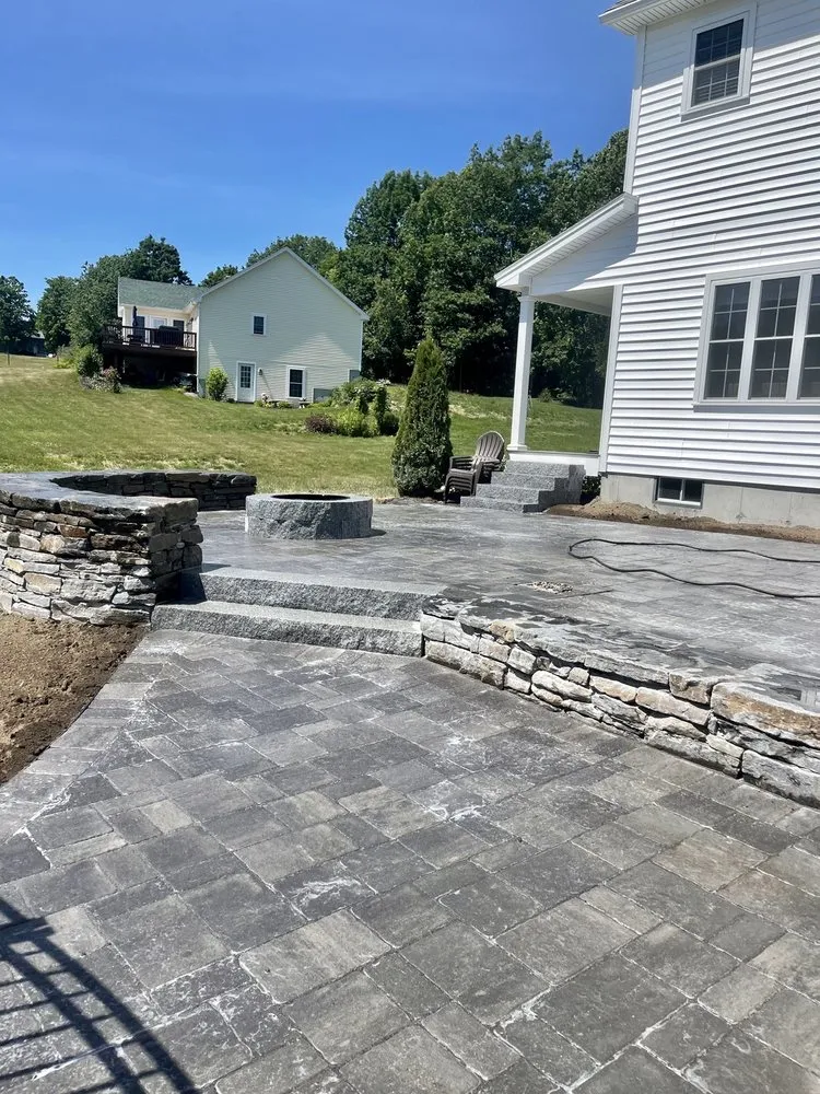 Professional lawn mowing service for year-round maintenance in Windham, ME by Higher Ground Landscaping