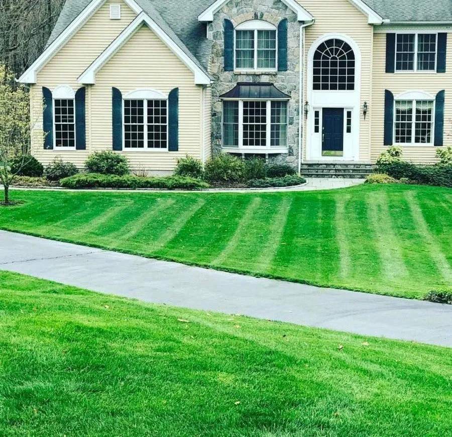Expert lawn mowing service for homes in Glastonbury, CT by Highwood Landscaping