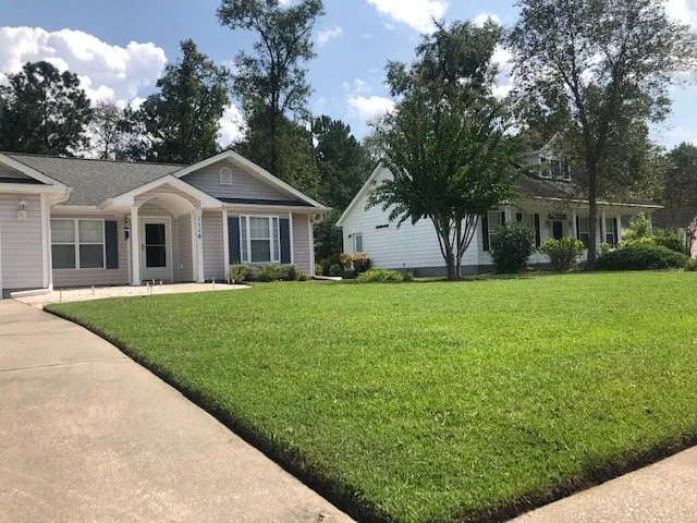 Custom garden landscaping with custom design in Conway, SC by Hills Cutting Edge