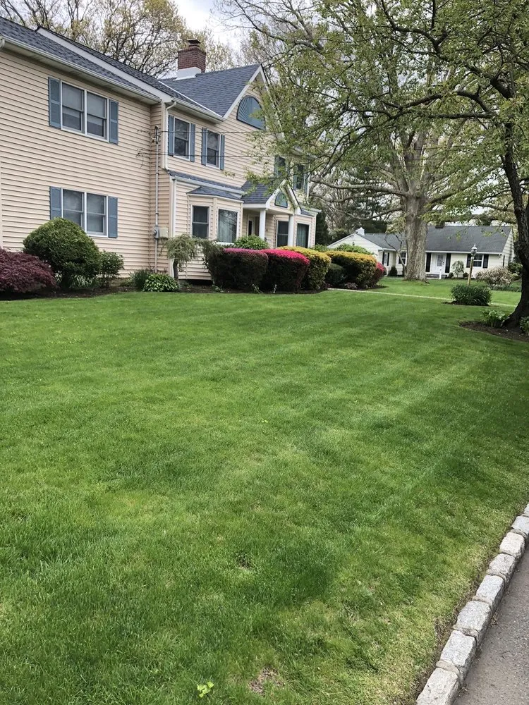 Affordable lawn mowing service in West Babylon, NY by HJR Landscaping