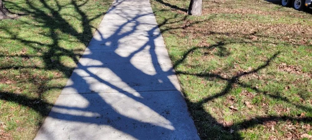 Affordable landscape installation for homes in Ottawa, KS by Hoein & Mowin