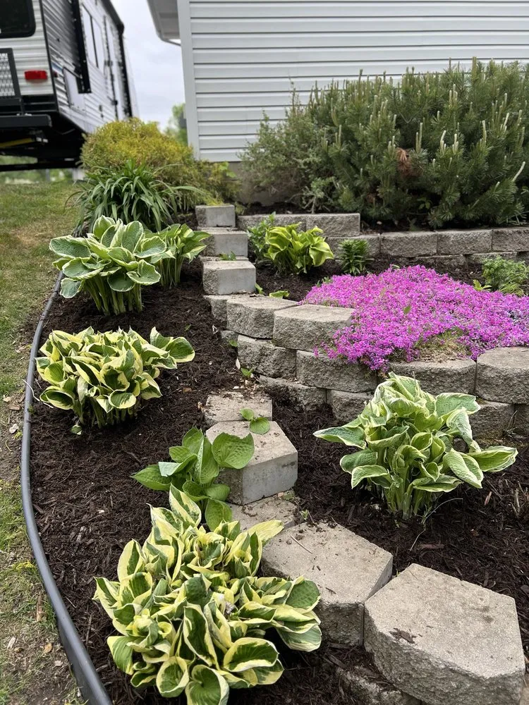 Custom residential landscaping with custom design in Isanti, MN by Holy Ground