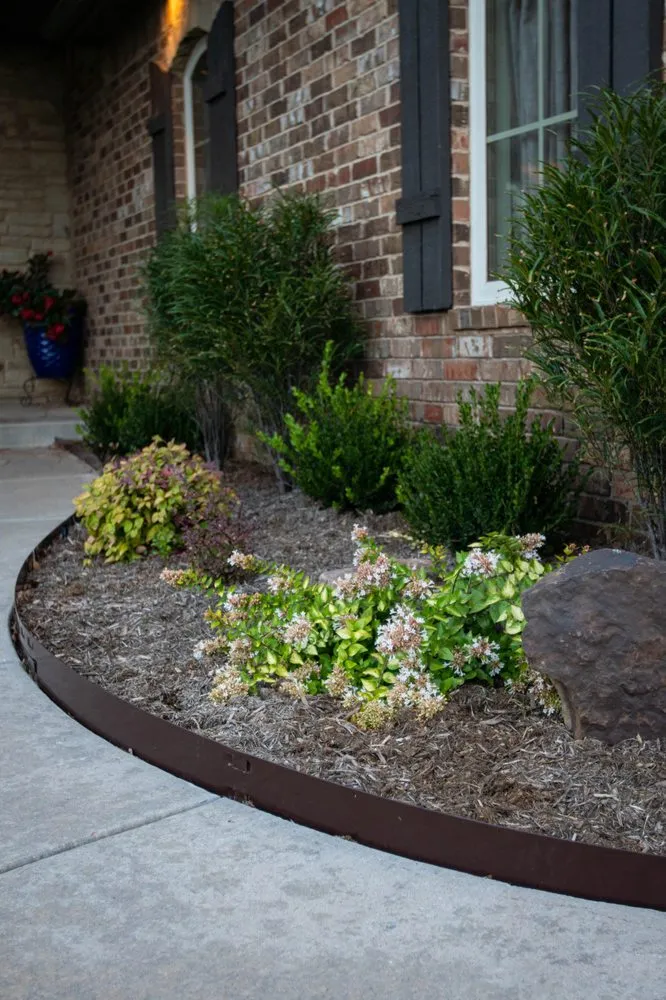 Custom yard cleanup service with custom design in Edmond, OK by Homestead Landscape & Construction