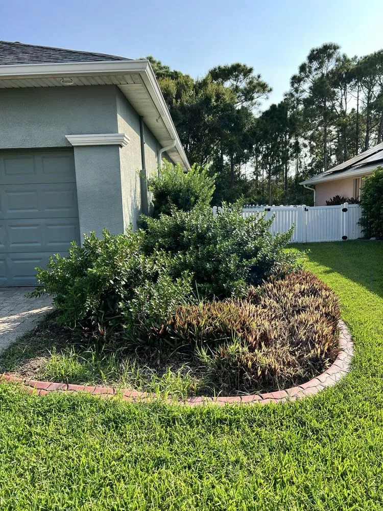 Custom yard maintenance for residential properties in Palm Bay, FL by Hooah Land Services