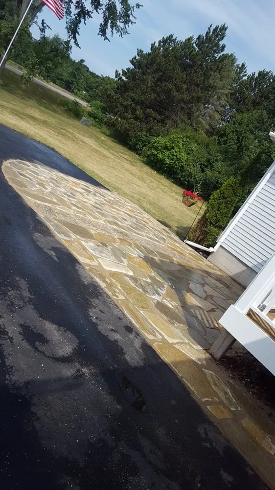 Professional yard maintenance for residential properties in Frankfort, MI by Hospenthal Outdoor Service