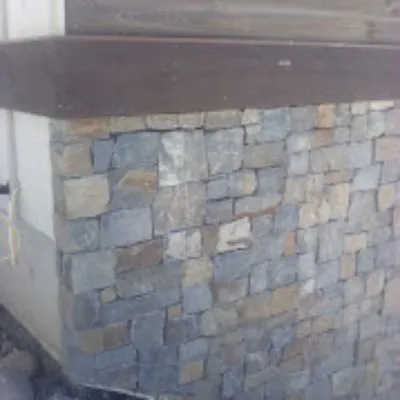 Huck N Stone Timber And Massonry Logo