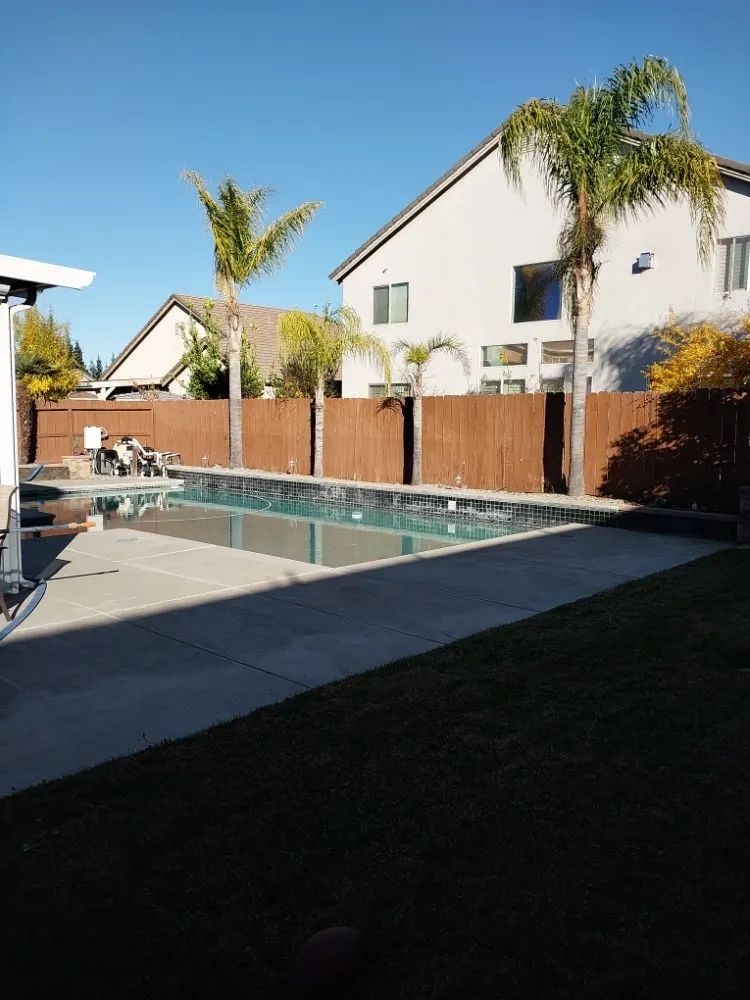 Local yard cleanup service for year-round maintenance in Manteca, CA by Hughes and Sons