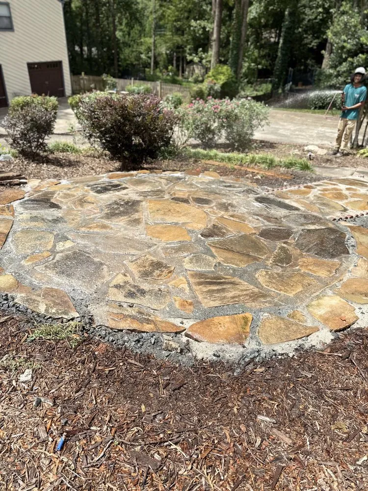 Custom outdoor landscaping for beautiful yards in Woodstock, GA by Humble Hero Solutions
