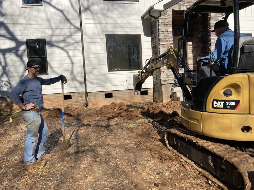 Professional yard cleanup service in Charlotte, NC by Hunter Grounds Construction