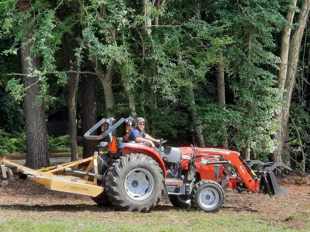 Local landscape design for outdoor upgrades in Carrsville, VA by Hunter’s Tractor & Stump Grinding Services