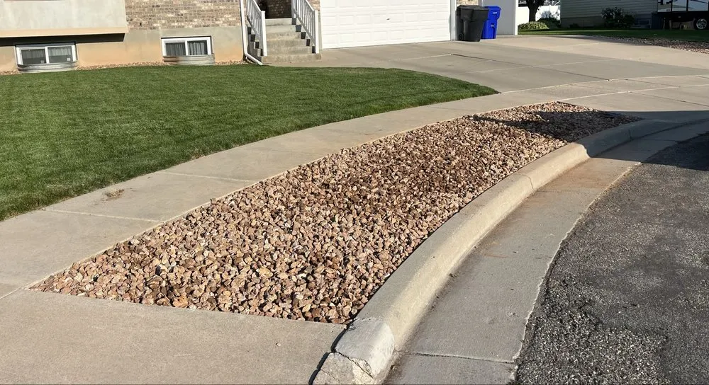 Professional landscaping services for year-round maintenance in Hooper, UT by Hustle Construction